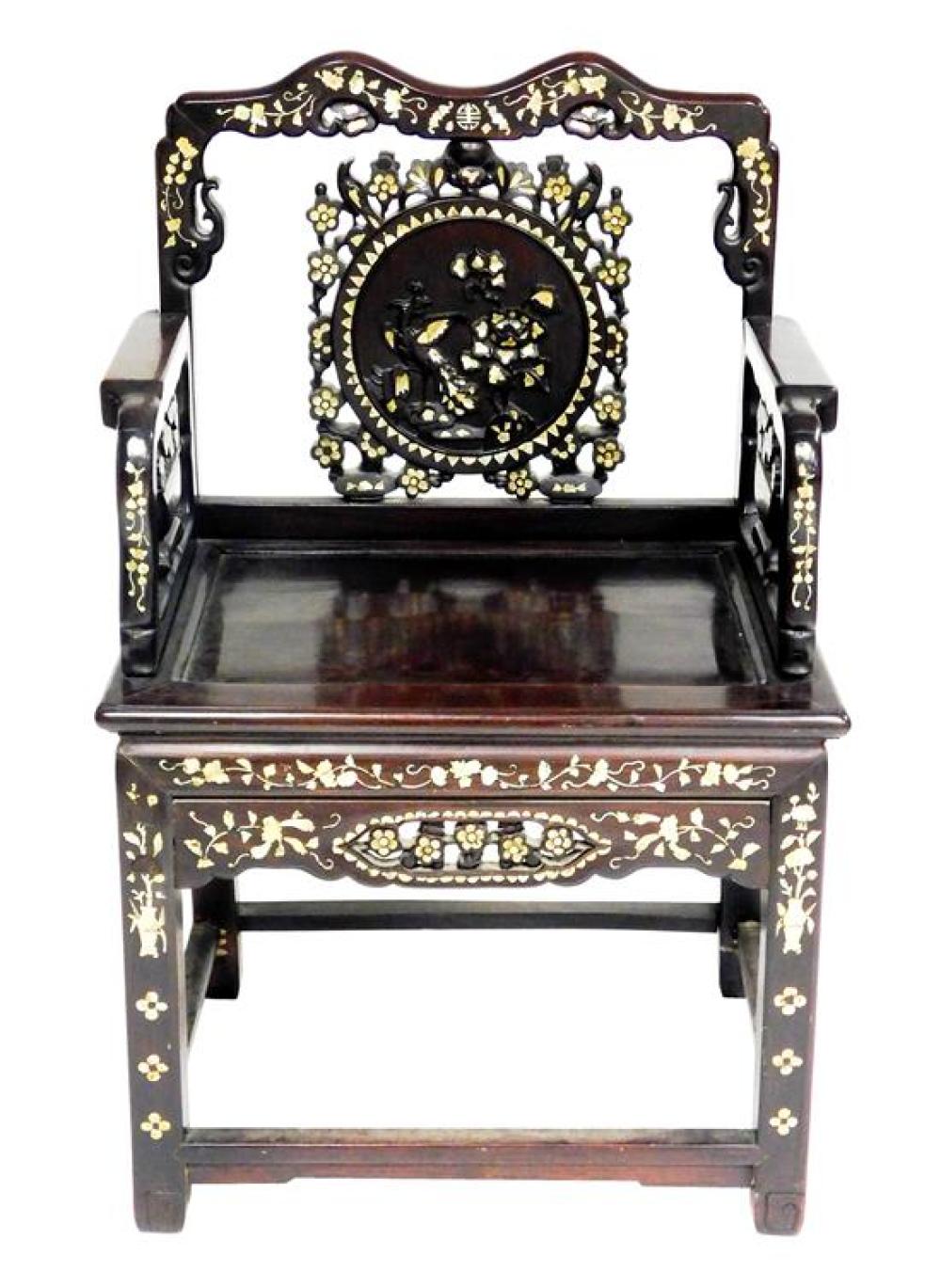 Appraisal: ASIAN Chinese hardwood armchair with extensive carved and inlaid Mother-of-Pearl