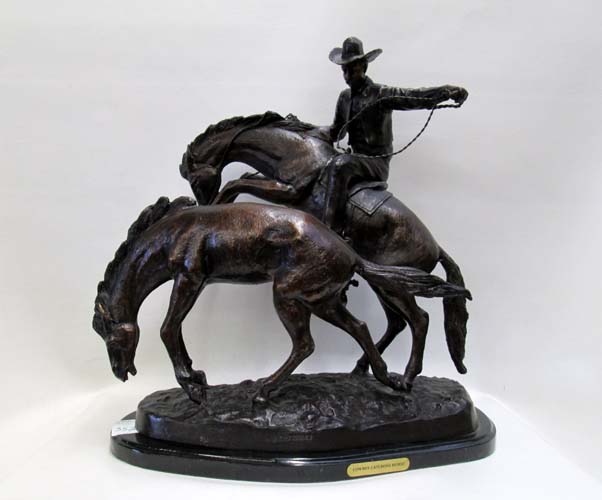 Appraisal: BRONZE SCULPTURE titled Cowboy Catching Horse signed J THEODORE The