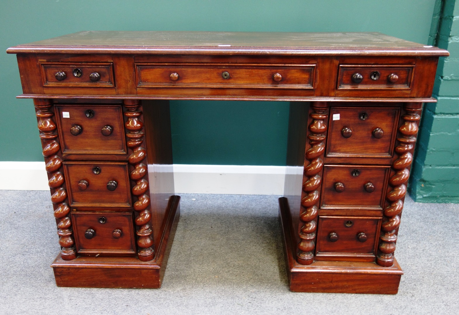 Appraisal: A small Victorian mahogany pedestal desk with nine drawers flanked