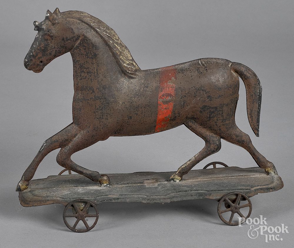 Appraisal: Early American tin running horse pull toy Early American tin