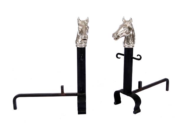 Appraisal: A pair of silvered bronze horse head chenets each measuring