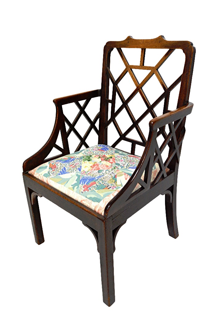 Appraisal: A George III mahogany cock pen armchair on block supports