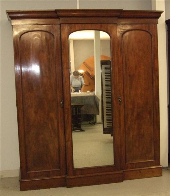 Appraisal: th Century mahogany break front wardrobe the centre section with