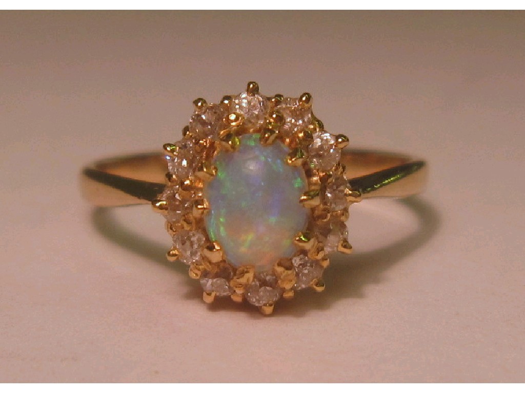 Appraisal: Eighteen carat gold opal and diamond cluster ring