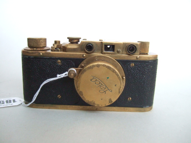 Appraisal: A replica Leica camera brass and leather mounted and detailed