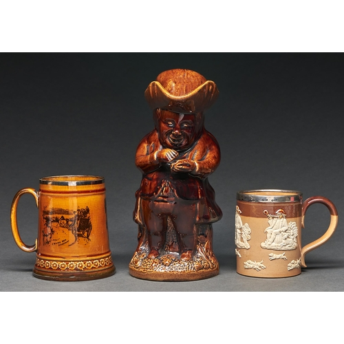 Appraisal: A Victorian treacle brown glazed snuff taker Toby jug and