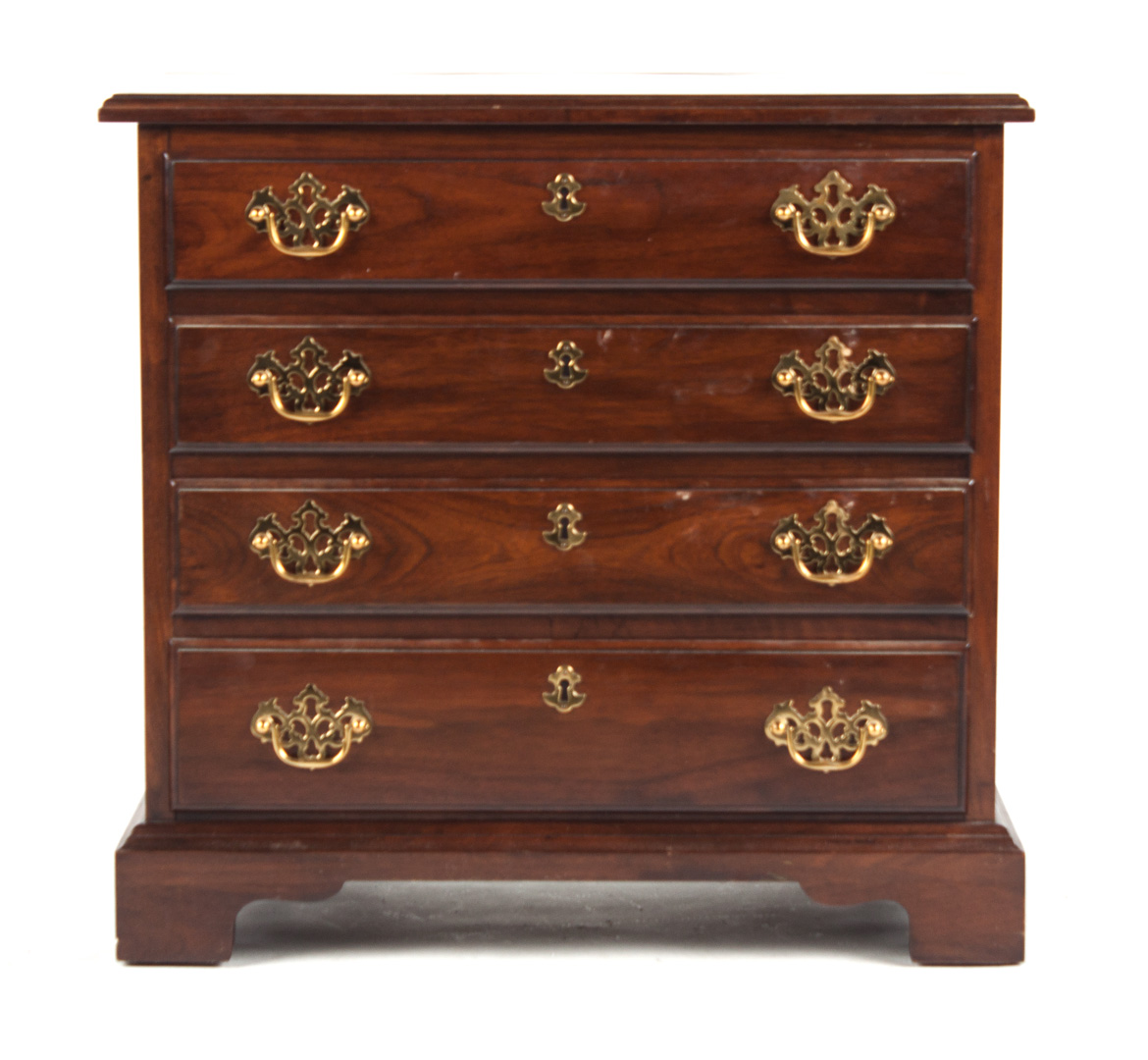 Appraisal: Henkel-Harris Chippendale bachelor's chest mahogany four-drawer chest with brass handle