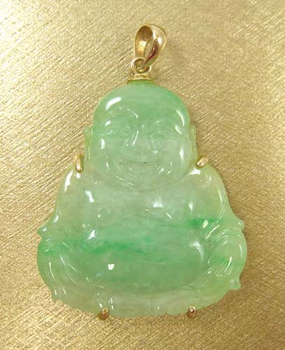 Appraisal: JADE PENDANT IN FOURTEEN KARAT GOLD the carved green figural