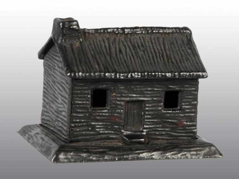 Appraisal: Cast Iron Cabin Still Bank Description Beautiful condition Condition Near