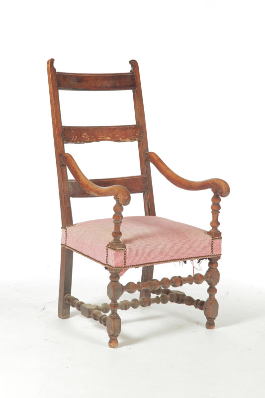 Appraisal: EARLY ARMCHAIR France th century walnut Spurred ears and turned