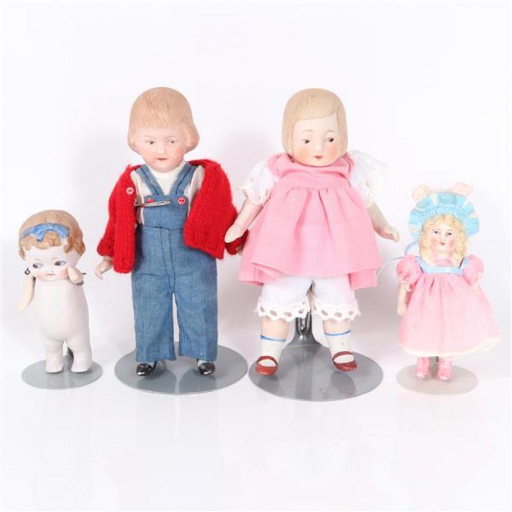 Appraisal: FOUR ALL BISQUE GERMAN CHARACTER DOLLS WITH MOLDED HAIR AND