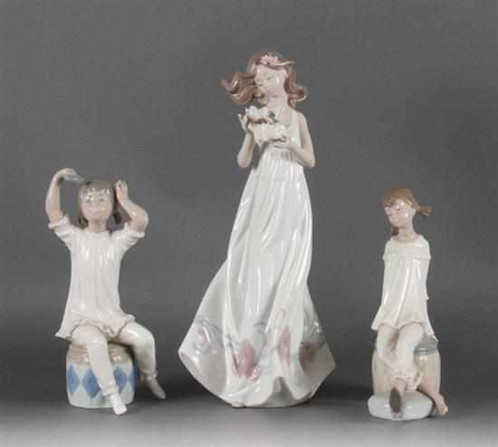 Appraisal: Three Lladro porcelain figures ''Butterfly Treasures '' and two girl