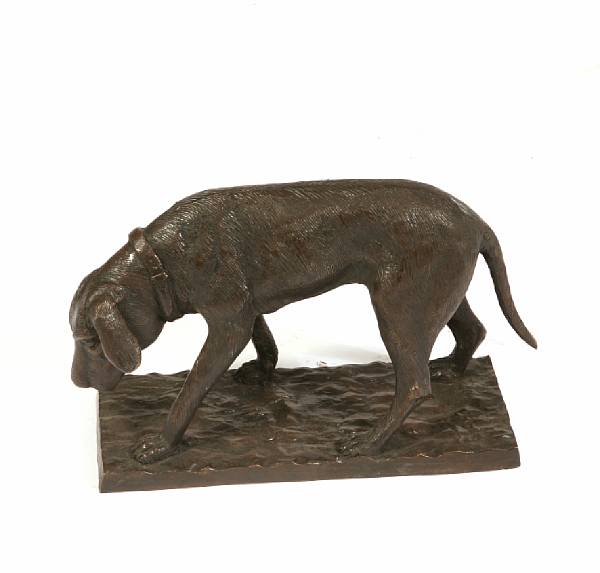 Appraisal: A patinated bronze figure of a dog height in width