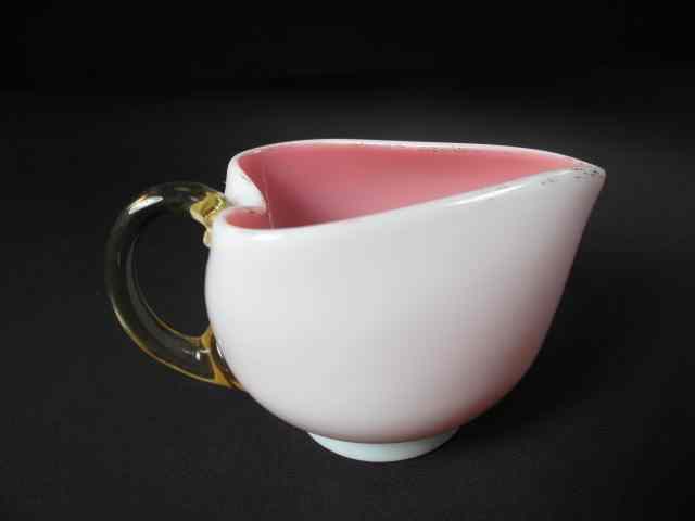 Appraisal: A Victorian miniature pitcher Cased white glass with pink interior