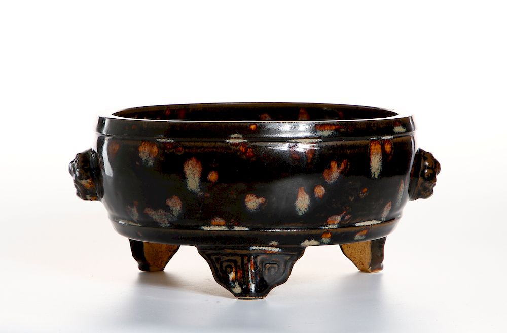 Appraisal: Chinese Russet-Splashed Black Glazed Tripod Censer The cylindrical body rising