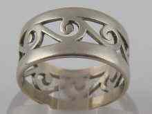 Appraisal: A white metal tests platinum ring with pierced scroll decoration