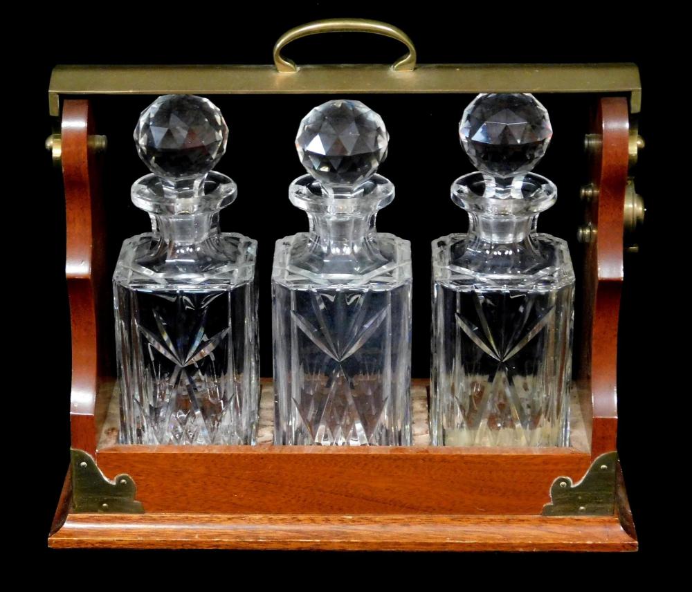 Appraisal: Travel decanter set c with three cut glass bottles set