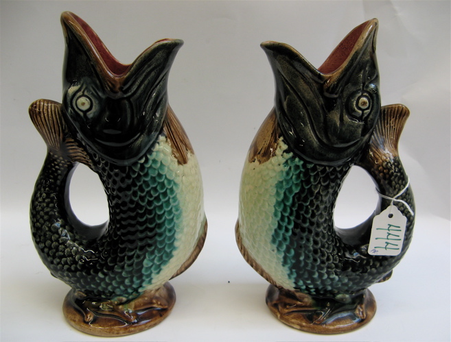 Appraisal: PAIR OF FIGURAL MAJOLICA POTTERY VASES in the form of