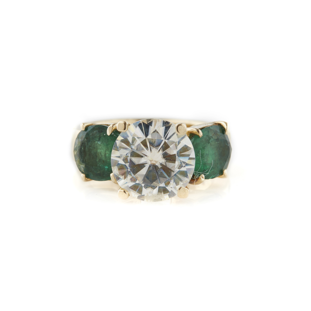 Appraisal: An emerald and imitation diamond set ring claw set with