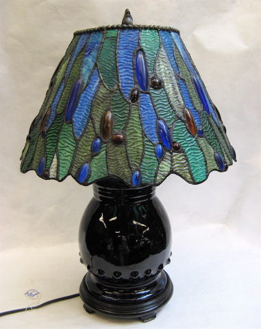 Appraisal: STAINED LEADED GLASS TABLE LAMP blue pottery based having a