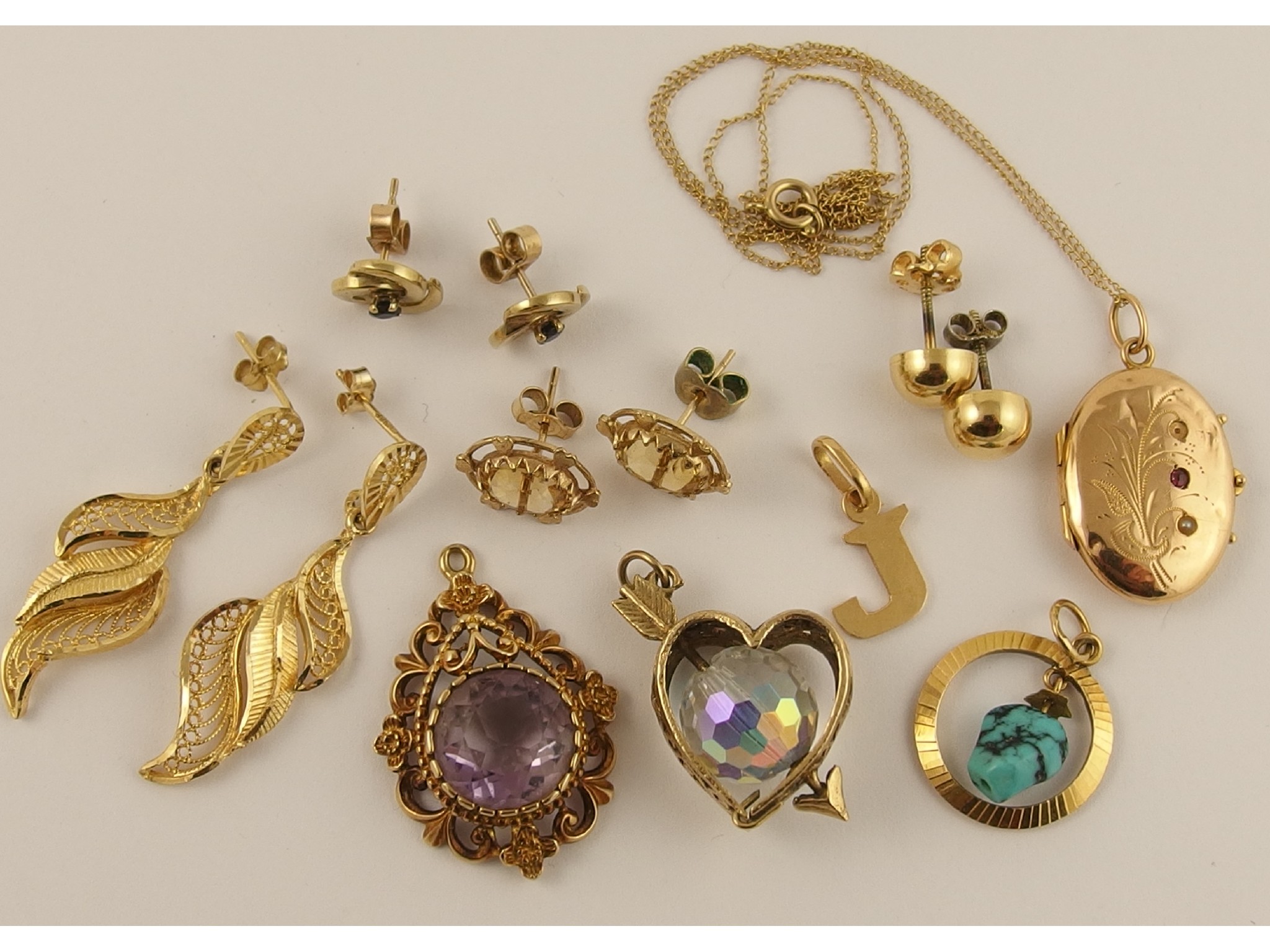 Appraisal: A collection of gold and yellow metal to include citrine