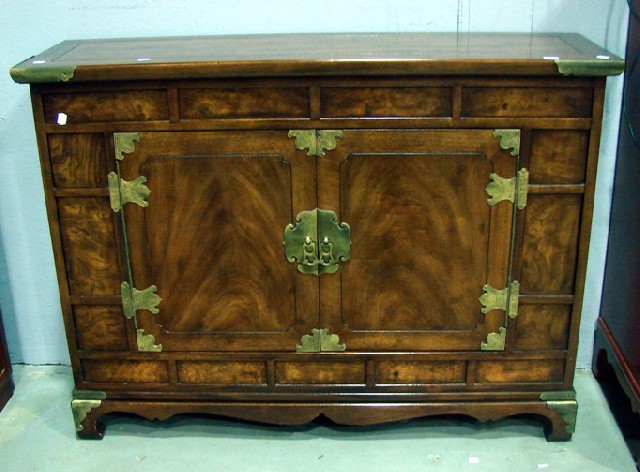 Appraisal: A Chinese side cabinet in rosewood and elm fitted with