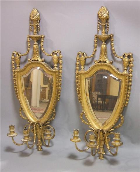 Appraisal: PAIR OF NEOCLASSICAL STYLE GILTWOOD GIRANDOLES each with shield-shaped mirrors