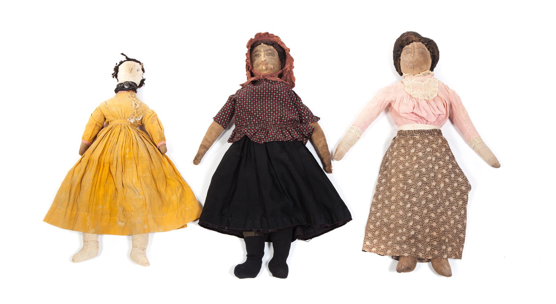 Appraisal: THREE CLOTH DOLLS WITH NEEDLE SCULPTED NOSES American nd half-