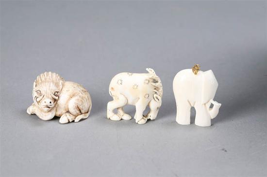 Appraisal: THREE SMALL CARVED FIGURES Horse h Elephant pendant h Warthog