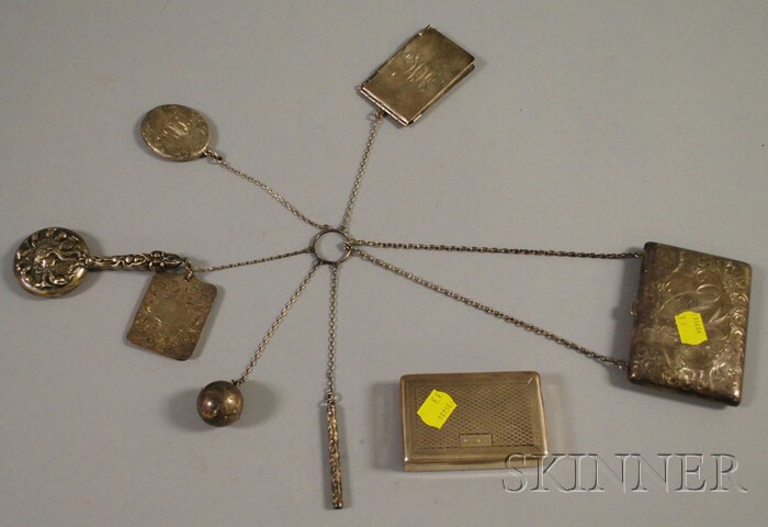 Appraisal: Two Small Silver Items a sterling chatelaine with purse mirror