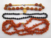 Appraisal: A mixed lot comprising a necklace with carved nut beads