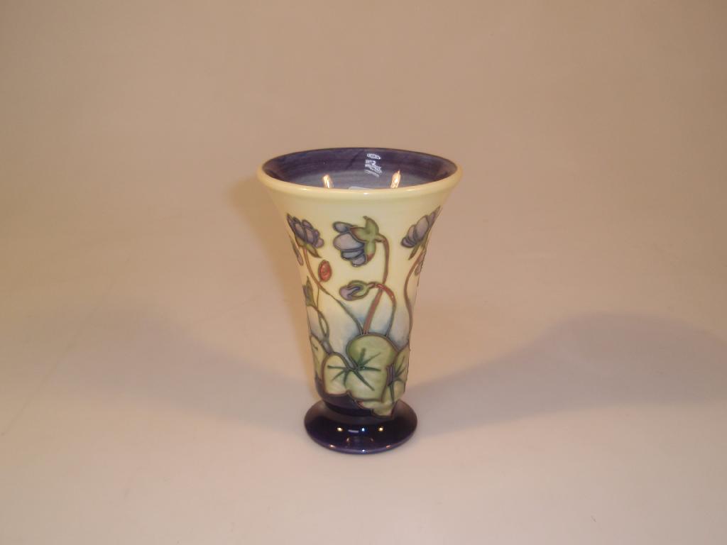 Appraisal: Moorcroft Modern a flared vase decorated with aquilegia green marks