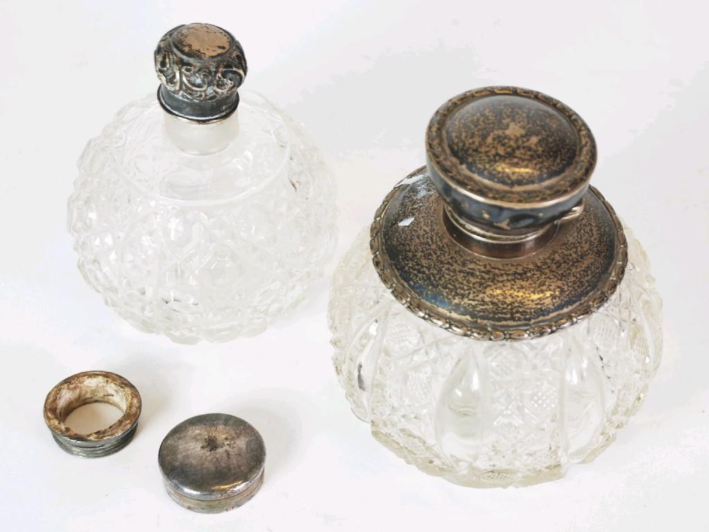 Appraisal: EDWARDIAN CUT GLASS PERFUME BOTTLE with silver collar and rim