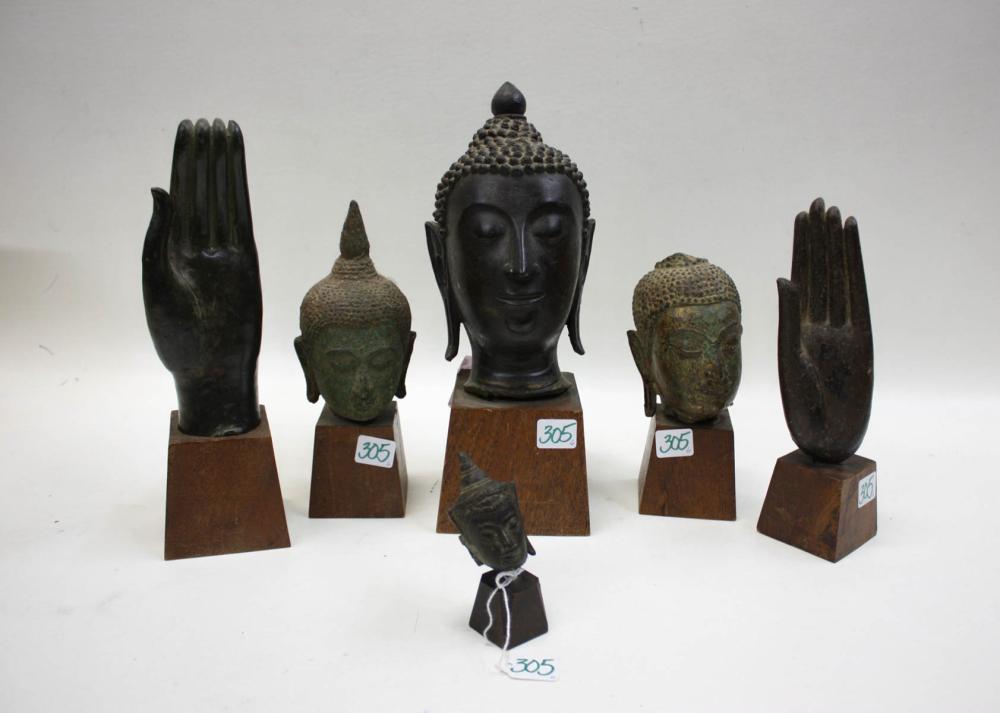 Appraisal: SIX BRONZE SCULPTURES including Buddha heads and Buddha hands three