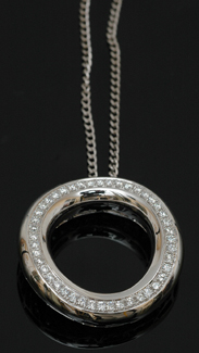 Appraisal: A diamond pendant The ct white gold circular design grain