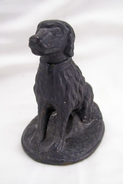 Appraisal: Antique Iron Dog Doorstop Cast iron seated dog with black