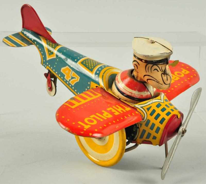 Appraisal: Tin Litho Marx Popeye the Pilot Wind-Up Toy Description American