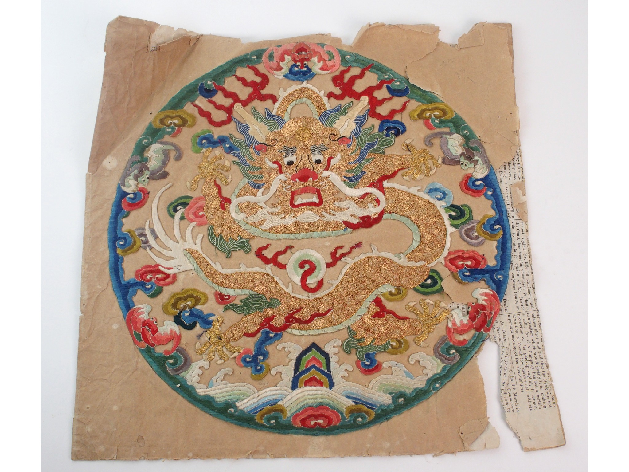 Appraisal: A Chinese silk embroidered roundeldepicting a front facing five-clawed dragon