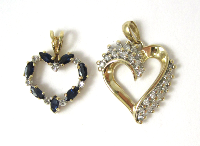 Appraisal: TWO YELLOW GOLD OPEN HEART PENDANTS including a k yellow