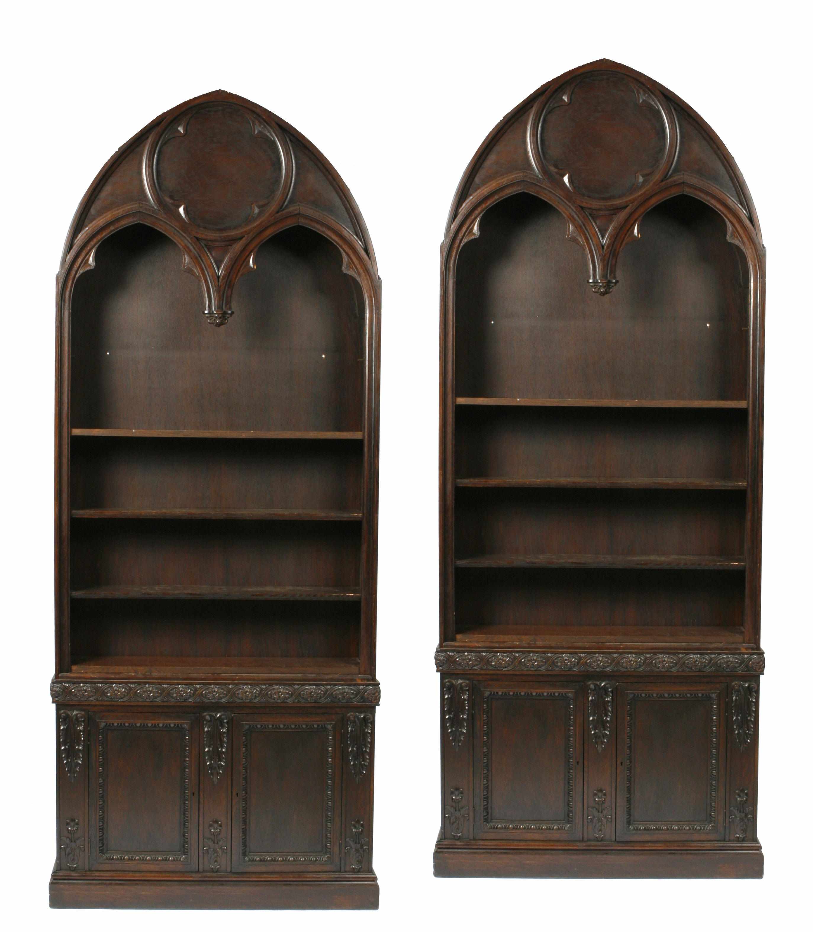 Appraisal: A pair of Gothic style oak bookcases height in width