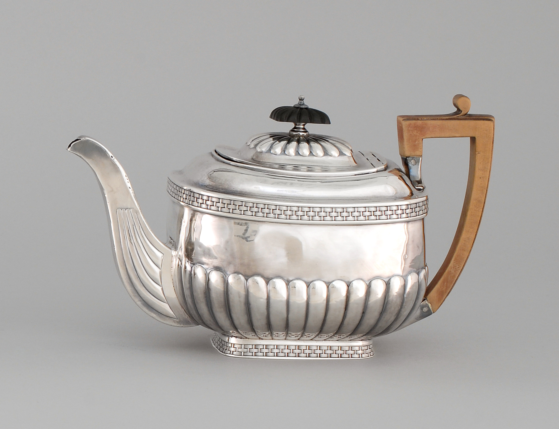 Appraisal: ENGLISH SILVER TEAPOT London - In rectangular form with half-rib