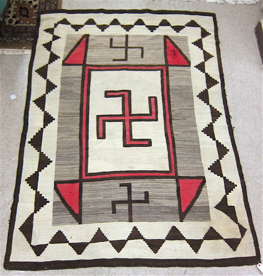 Appraisal: NAVAJO RUG whirling log swastika design in red brown dark