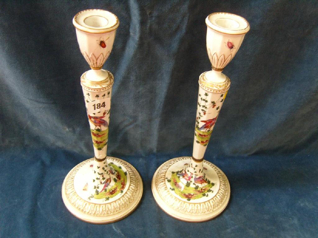 Appraisal: A pair of tall th century candlesticks in the Worcester