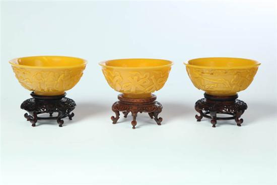 Appraisal: THREE BOWLS Asian th century Carved yellow hardstone bowls h