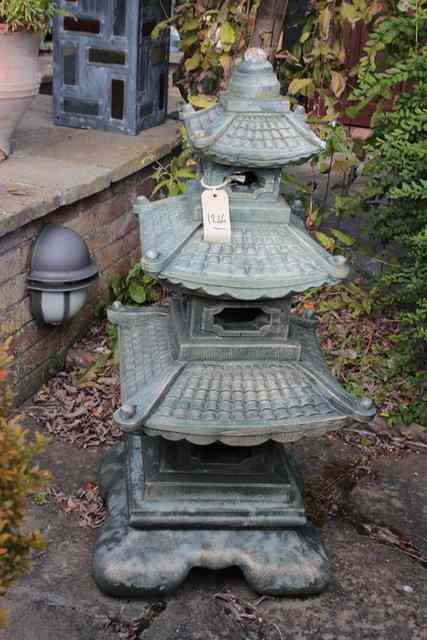 Appraisal: A RECONSTITUTED STONE GARDEN ORNAMENT in the form of a