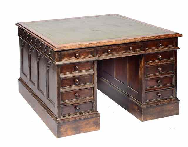 Appraisal: A LATE VICTORIAN OAK PEDESTAL DESK IN GOTHIC REVIVAL STYLE