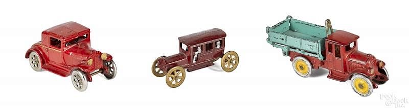 Appraisal: Three cast iron toy vehicles Three cast iron toy vehicles