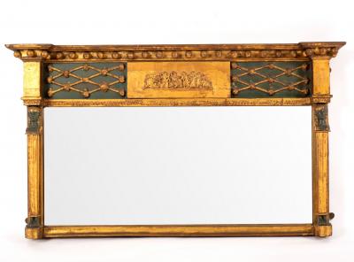 Appraisal: An Egyptian revival overmantel mirror with ball studded freeze flanked