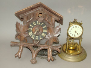 Appraisal: A Black Forest type wooden cased cuckoo clock with iron