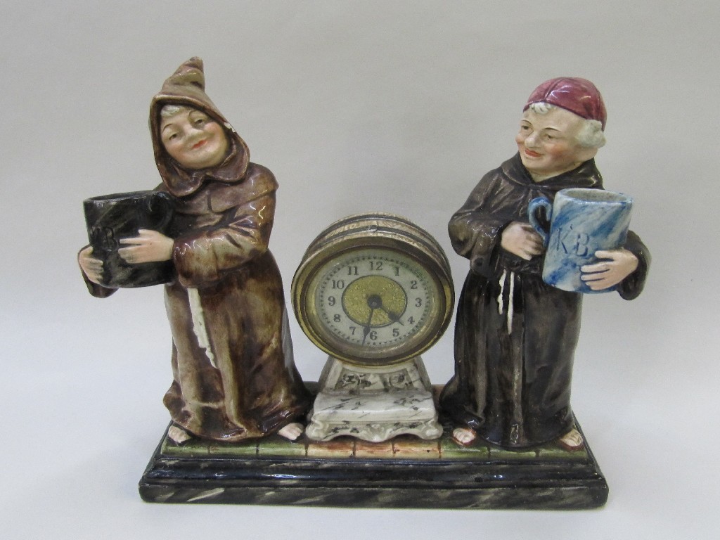 Appraisal: Continental pottery mantel clock modelled with two merry monks